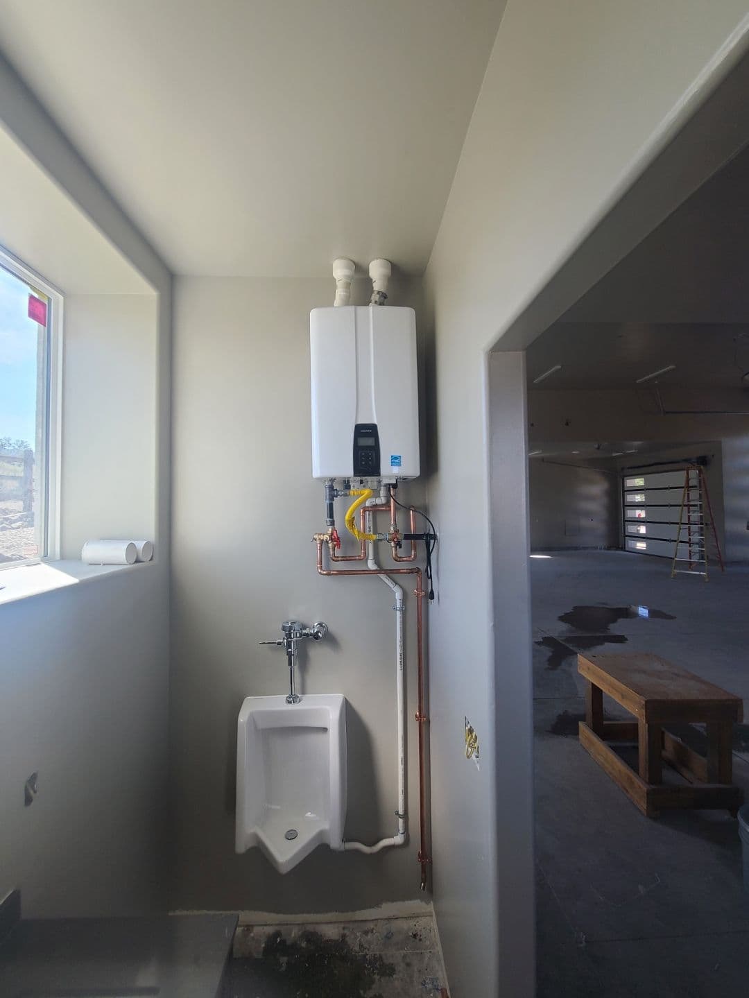 Efficient Tankless Water Heater Installed in a Garage